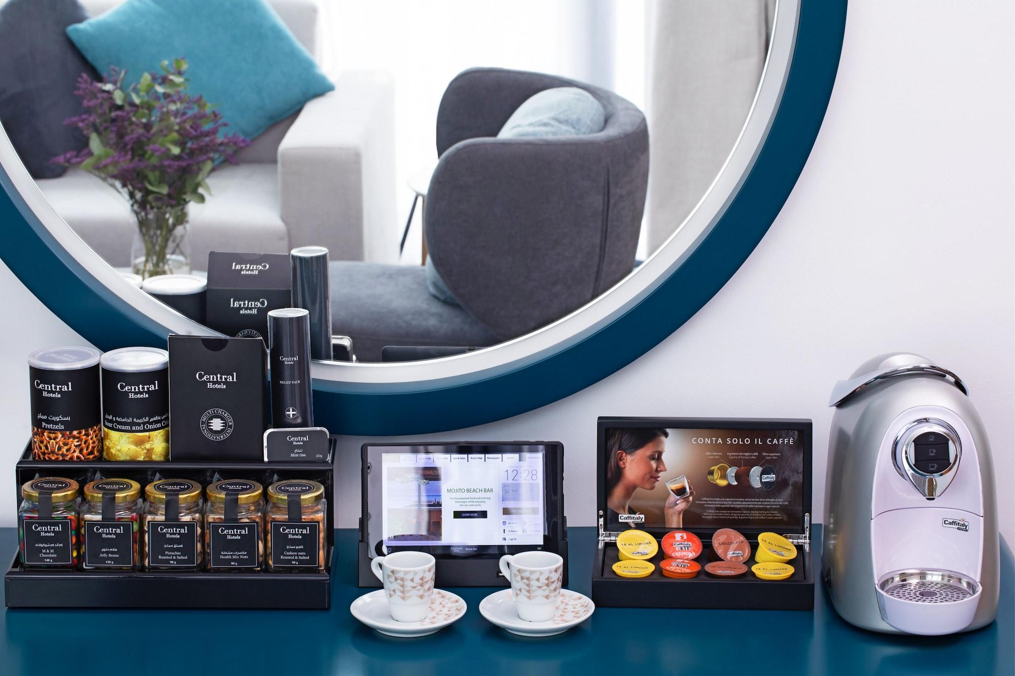 C Central Hotel And Resort The Palm Dubaï Extérieur photo A Nespresso coffee machine in a Nespresso machine station